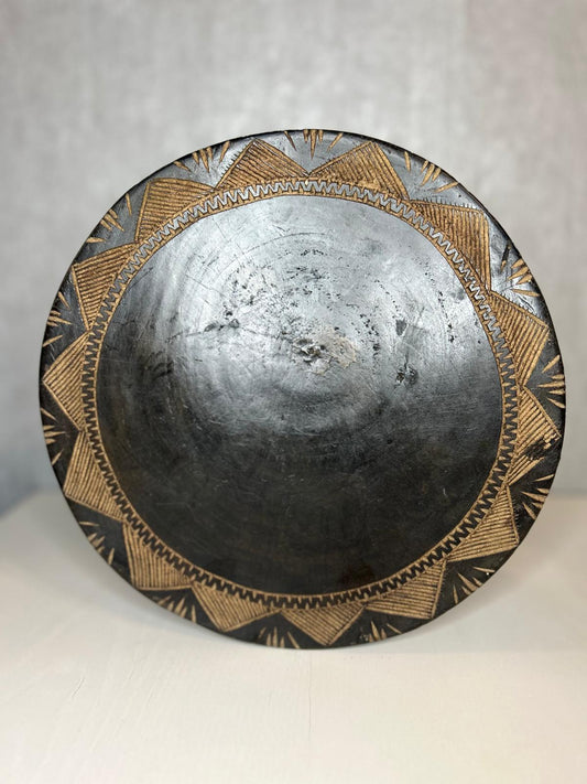 Tabouret Baga sculpté